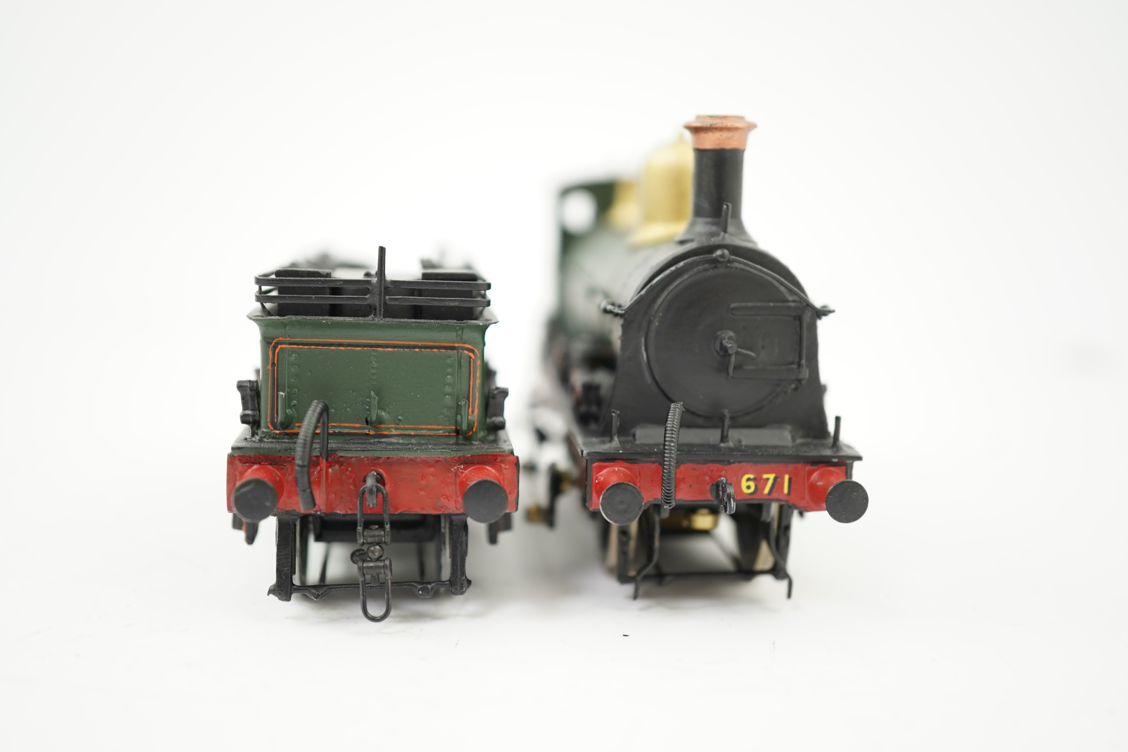 Two 00 gauge brass and white metal kit built GWR tender locomotives; an Armstrong 0-6-0, 671, together with an Earl class 4-4-0, Earl of Berkeley 3217, constructed, painted and lined to a high standard, both motored for